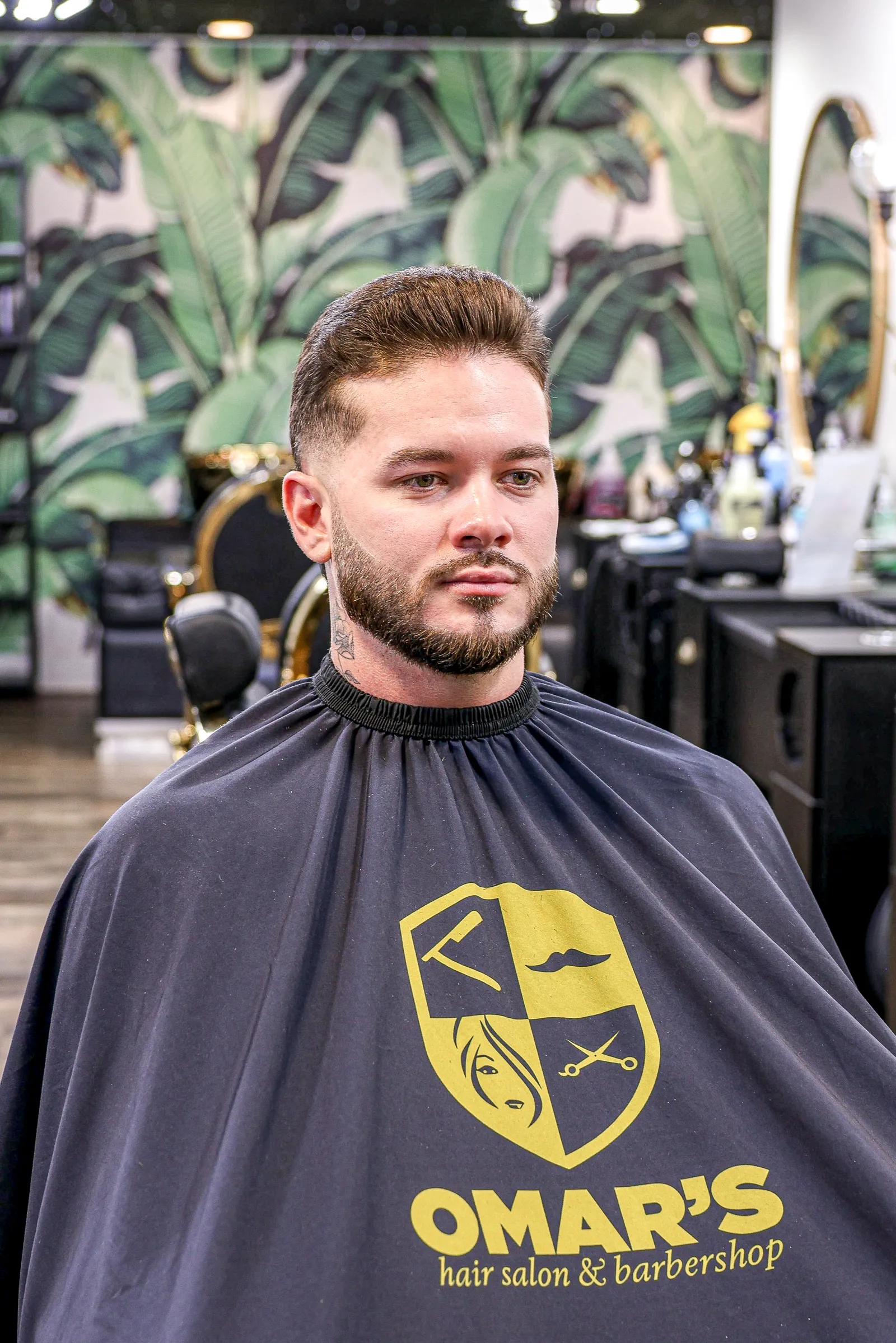 Barber trimming hair